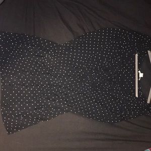A Black Billabong linen dress with white polkadot